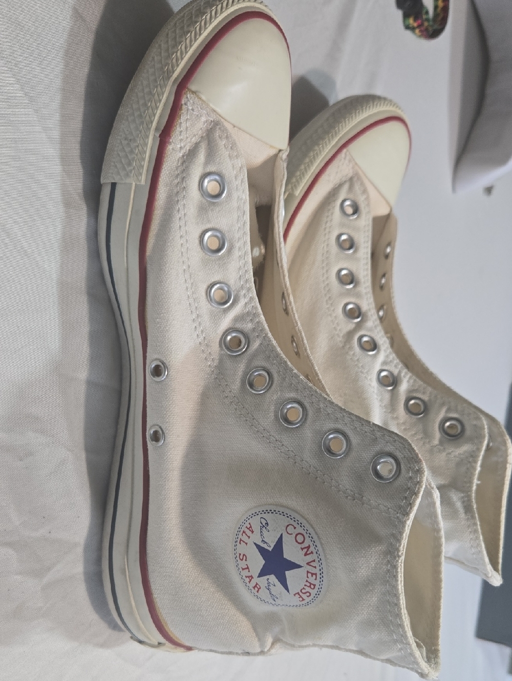 Converse High Top Sneakers in Cream with Red Trim